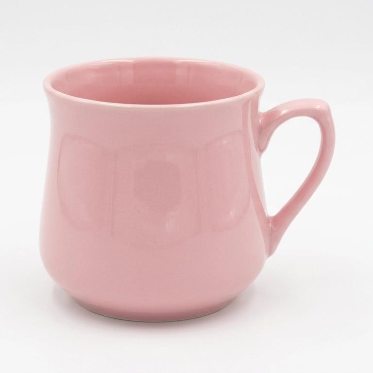 A pink porcelain mug photographed on a plain white background
