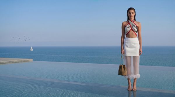 AI model standing at the pool edge